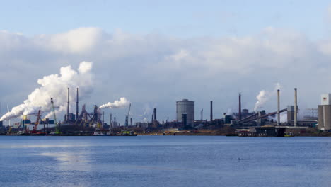 Time-lapse-of-polluting-industrial-area-near-harbor---zoom-out