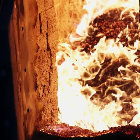 burning wood chip pellets a renewable source. burning wood chip pellets a renewable source, modern wood-burning stove to heat house in winter