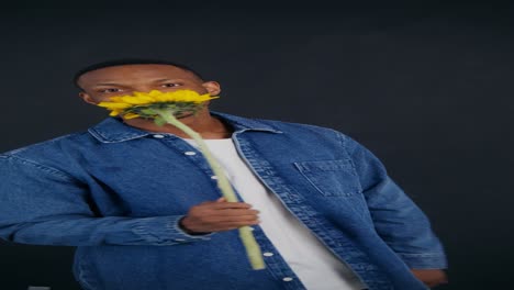 man holding a sunflower
