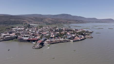 flight over the small town of petatan by the chapala lake in mexico