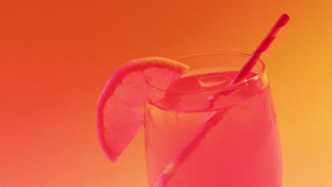 close up of drink with orange on orange background