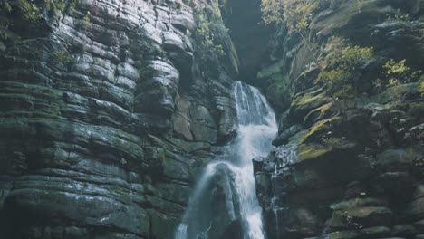 dark cave waterfall looking up a hole at the top