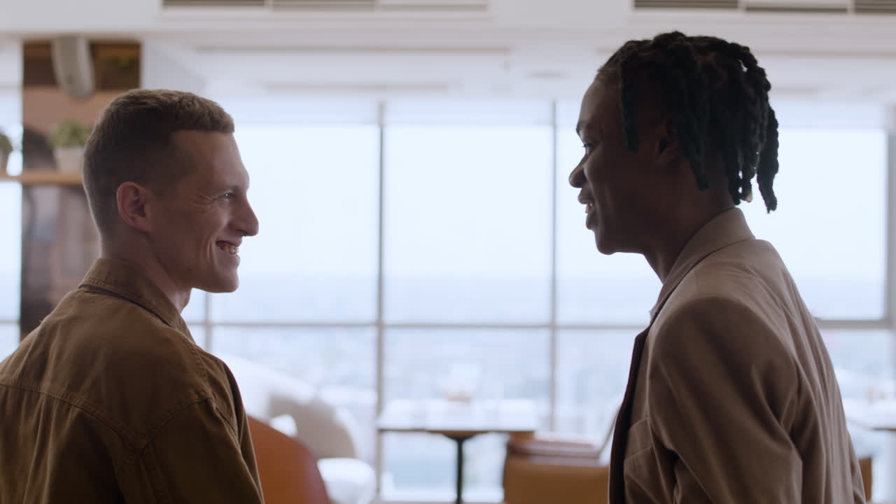 Conversation between two colleagues in a restaurant