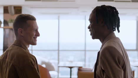 conversation between two colleagues in a restaurant