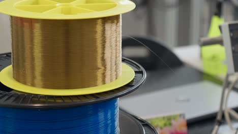 Spools-of-different-glass-fiber-threads-in-laboratory