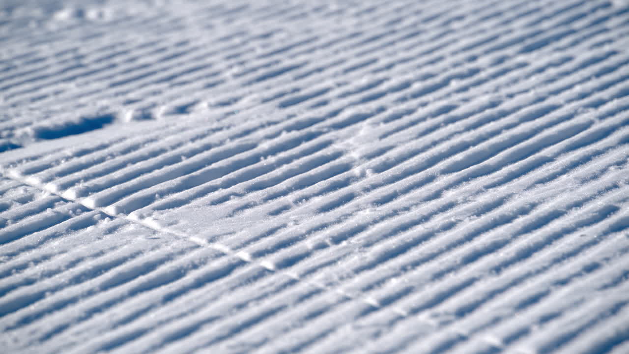 Close up of lines on the snow prepared for skiing on the mountain in the Dolomites, Italy