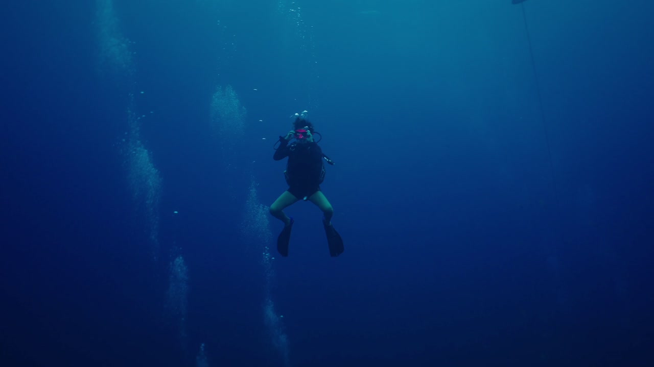 Scuba Diver in Deep Blue Water