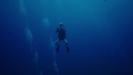 scuba diver in deep blue water