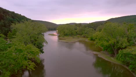 drone aerial passing trees of the susquehanna river in pennsylvania