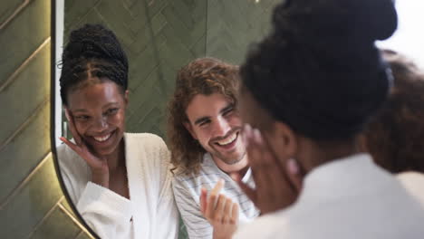 Diverse-couple:-a-young-African-American-woman-and-a-young-Caucasian-man-share-a-joyful-moment