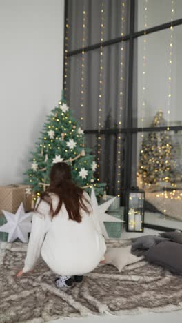 woman in pajamas enjoying christmas