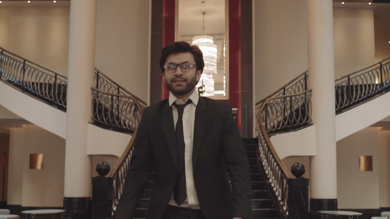 Delighted Businessman Dancing Going Down Staircase