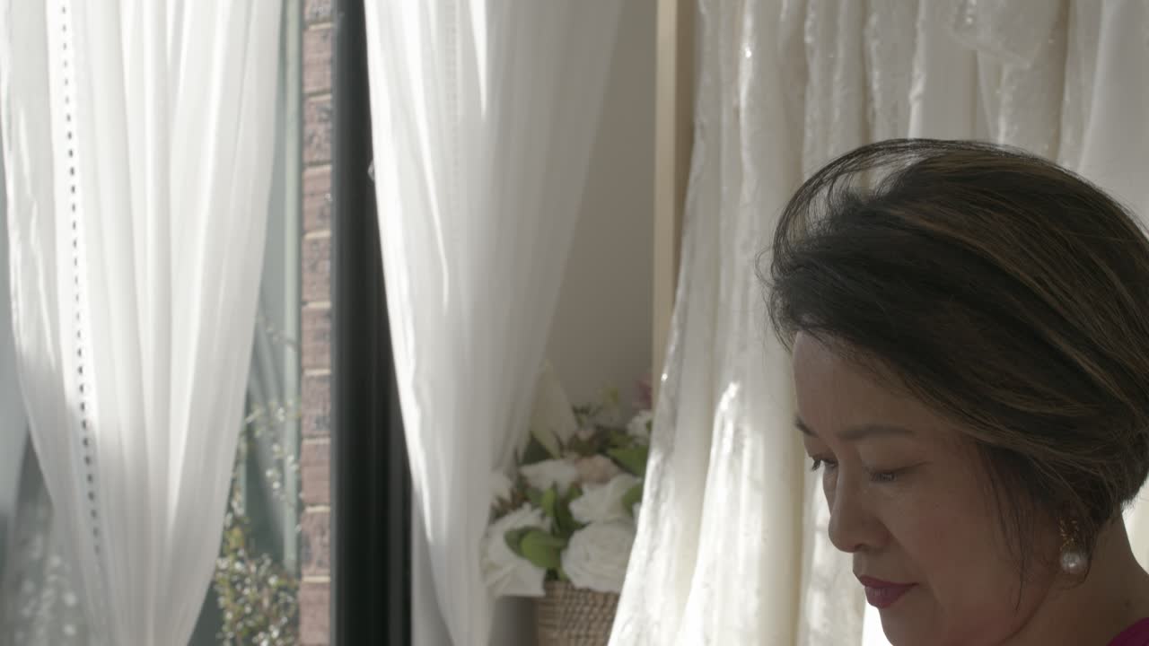 The lady is getting ready for her wedding, which is going to be a very special day for her