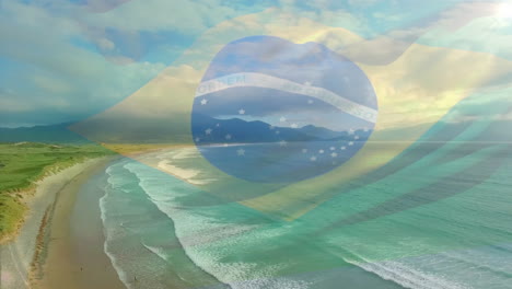 digital composition of waving brazil flag against aerial view of the beach