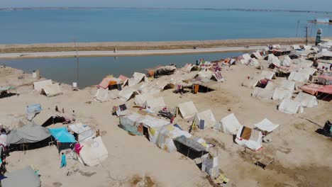 aerial flying over makeshift camps for flood disaster victims in maher, sindh