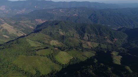 AERIAL-High-Over-Thai-Mountain-Ranges-On-A-Misty-Morning