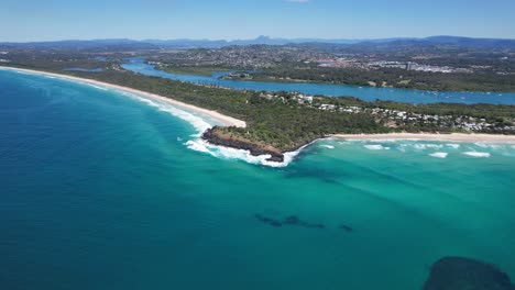 fingal head village with tweed river in the background in new south wales, australia. aeria shot
