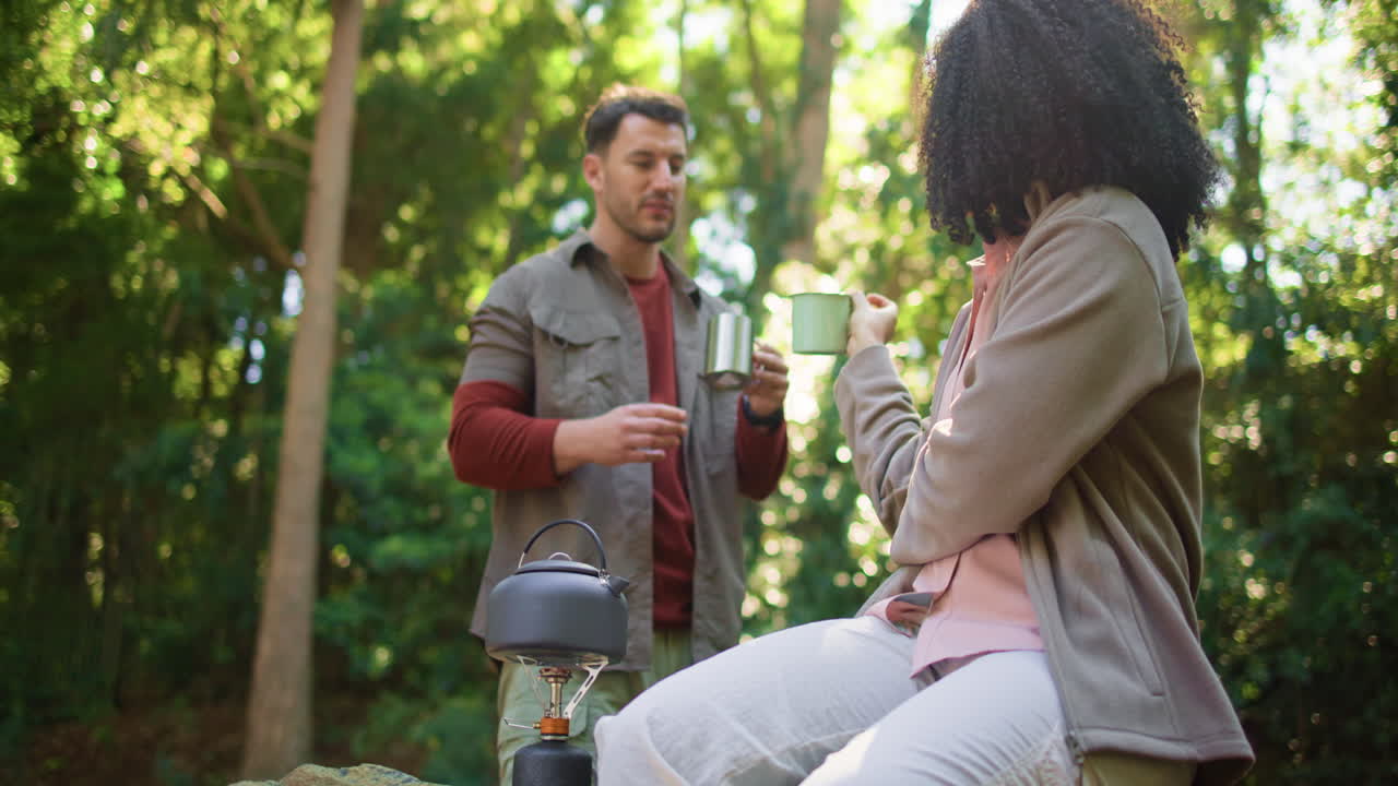 Couple Camping and Enjoying Coffee in the Forest