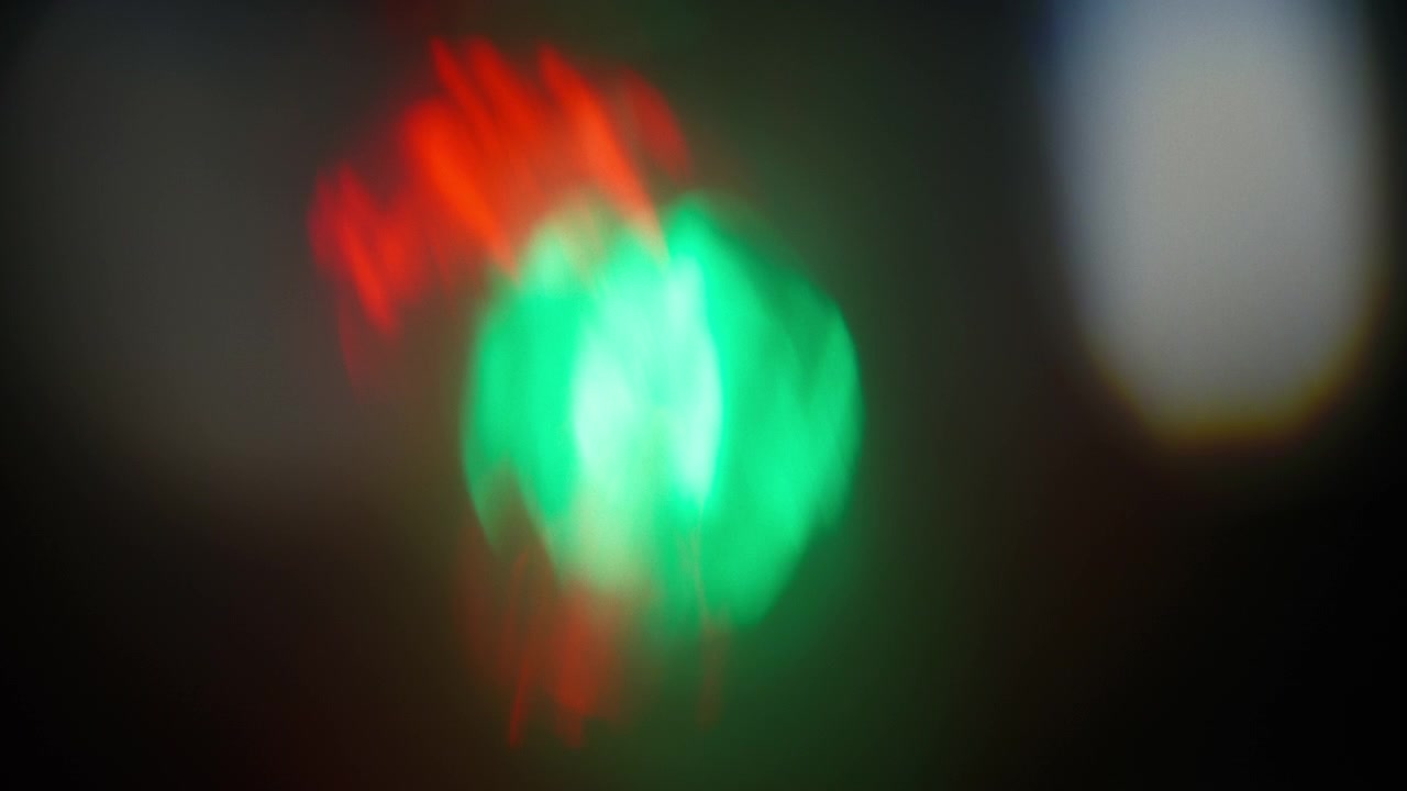 Abstract prism overlays of gradient green and red colors with light leaks