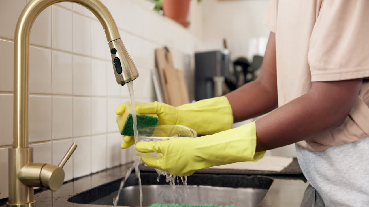 Washing dishes in the kitchen sink