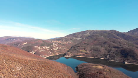 the beautiful quiet rocky  mountains and lake in italy - aerial