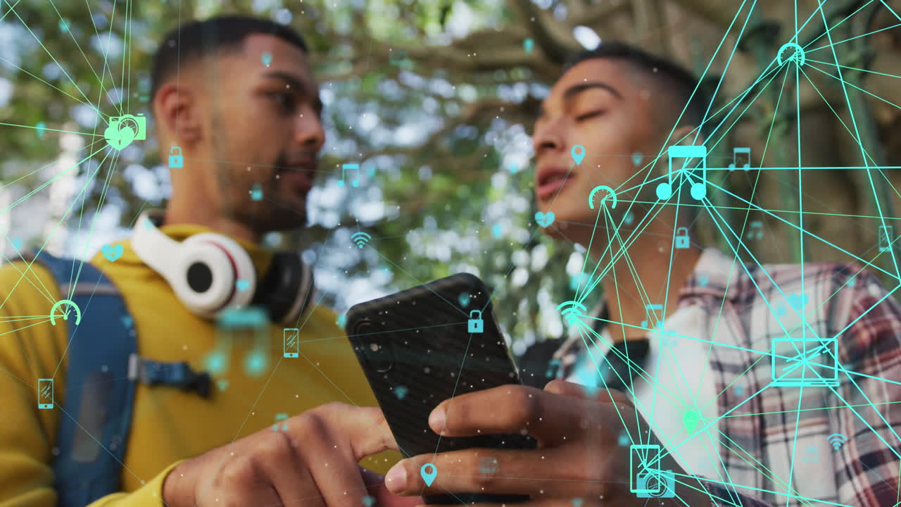 Animation of connections and data processing over biracial man using smartphone