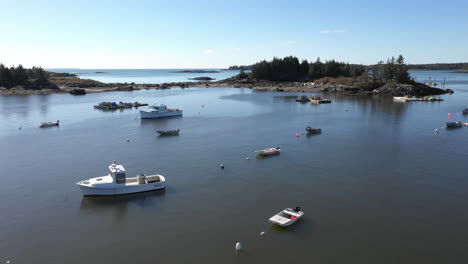 aerial fly by drone footage over parked boats at vinalhaven, maine coast, fox islands, knox county, maine, usa