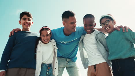 Volunteer-man,-kids-group-and-together-with-face