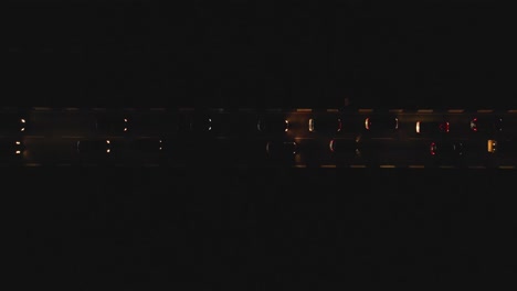 cars in heavy lagos traffic at dusk through till night