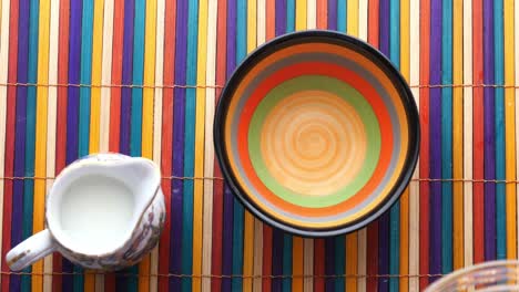 colorful cereal pouring into a bowl