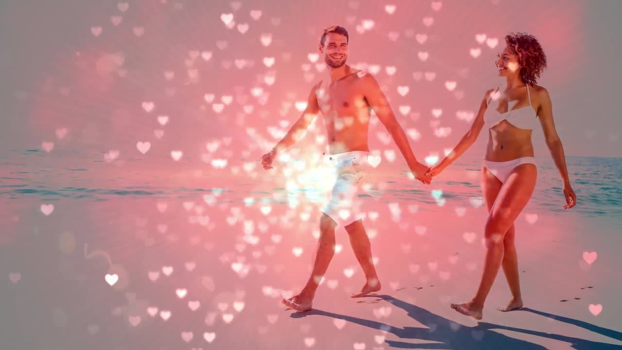 해변에서 손을 잡고 있는 행복한 커플