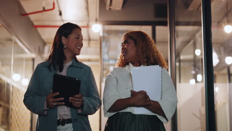 Business,-women-talking-and-walking-in-office