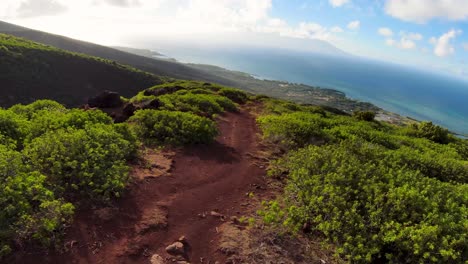 following-the-path-towards-of-amazing-and-blue-ocean-over-Molokai-mountain-peak-with-incredible-shadows-at-sunny-day-with-some-clouds