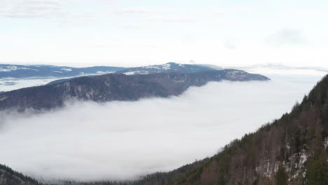 aerial of beautiful valley seen above the clouds