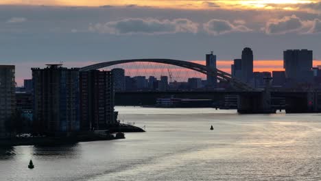the van brienenoordbrug bridge during sunset in rotterdam, netherlands - wide shot