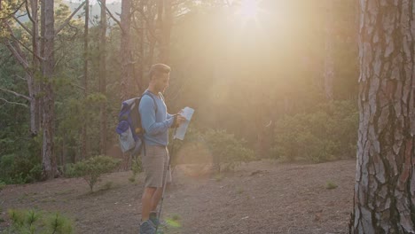 male traveler reading map