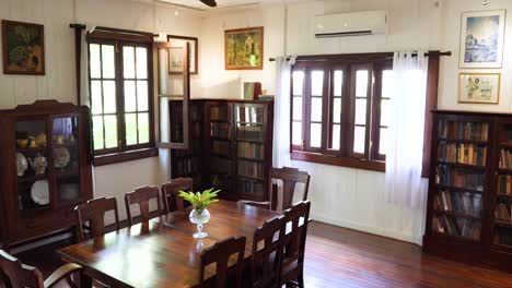 elegant vintage dining room with bookshelves