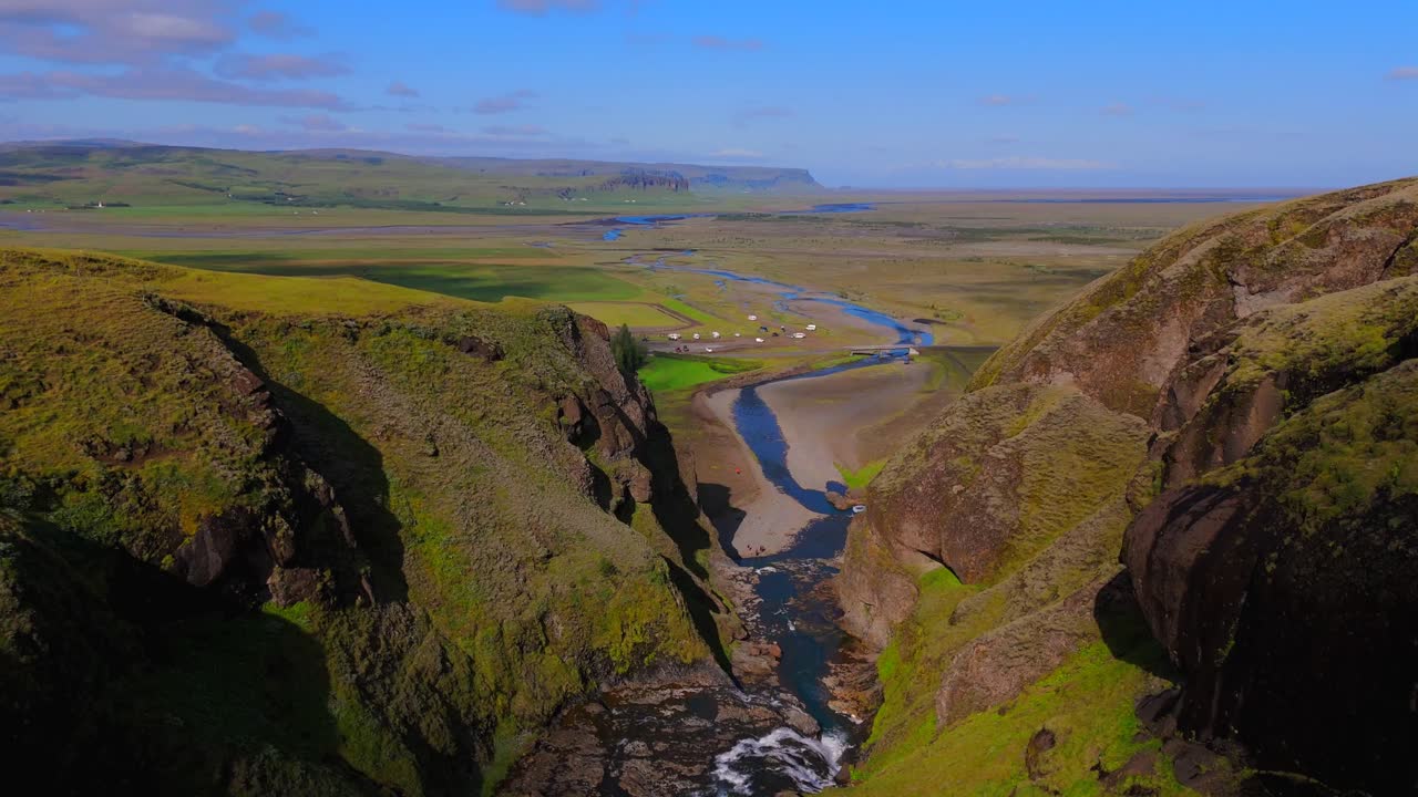 Soar over Kirkjubæjarklaustur with breathtaking drone views that showcase its rich history, vibrant greenery, and the striking contrast of rugged terrain against the tranquil surroundings.