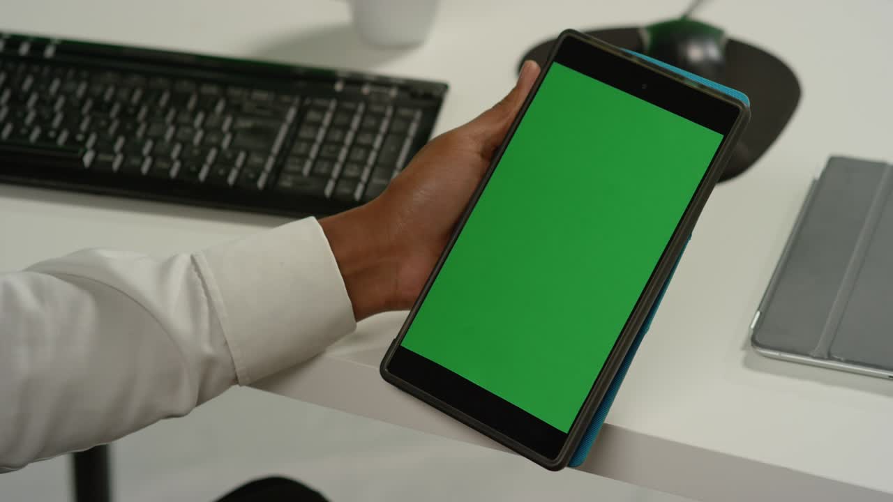 CU Man at Swiping on Tablet with Green Screen