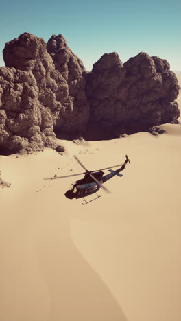 helicopter flying over a desert landscape