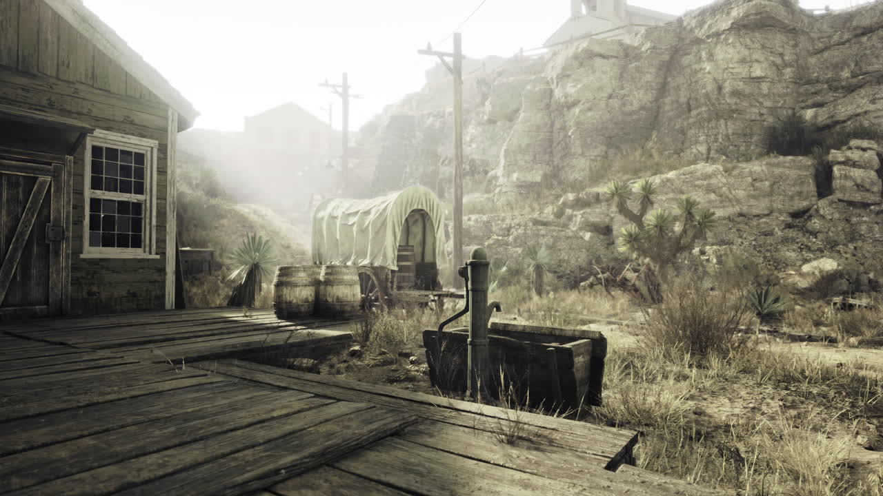 A quiet abandoned settlement reveals a wooden structure beside a hand pump