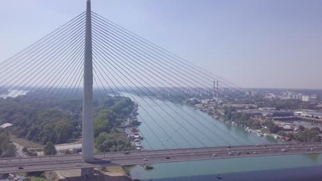 orbiting 4k aerial shot of ada lake, new belgrade and ada bridge