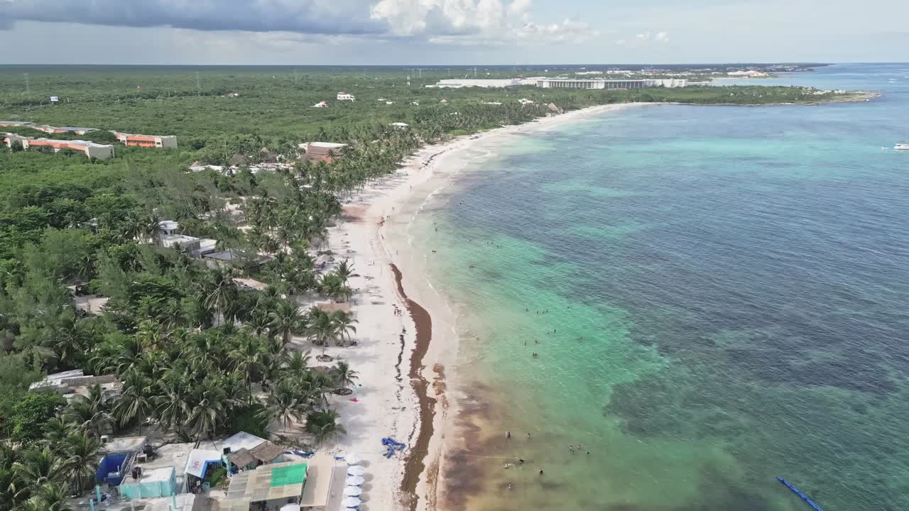 Aerial view of serene Xpu-ha beach near Playa del Carmen in clear weather