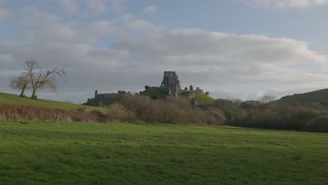 slow zoom in shot of corfe castle with moving clouds over the scene