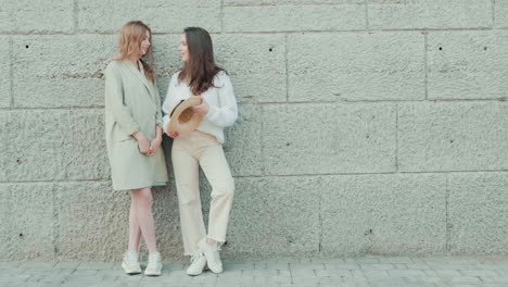 two young women enjoying conversation outside