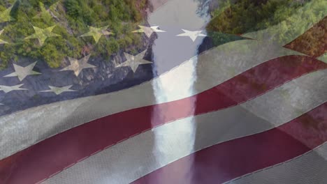 animation of american flag over aerial view of forest and waterfall