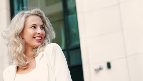 smiling woman in a white jacket