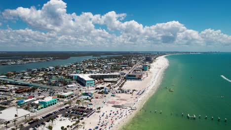 static drone shot showing fort myers beach and estero island on a sunny day