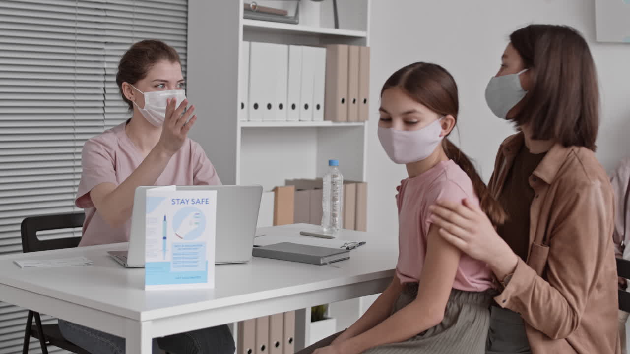 Young Nurse Registering Patients