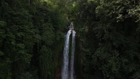 Close-up-to-a-wide-view-of-Gitgit-waterfall-in-the-north-of-Bali,-Indonesia